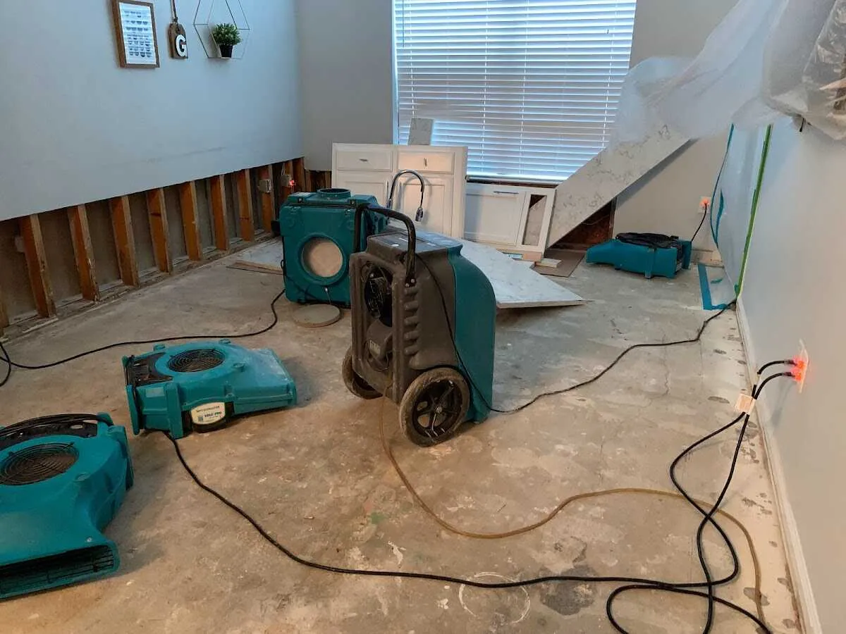 Dehumidifier in flood-cut room for Water Damage Restoration in Adel